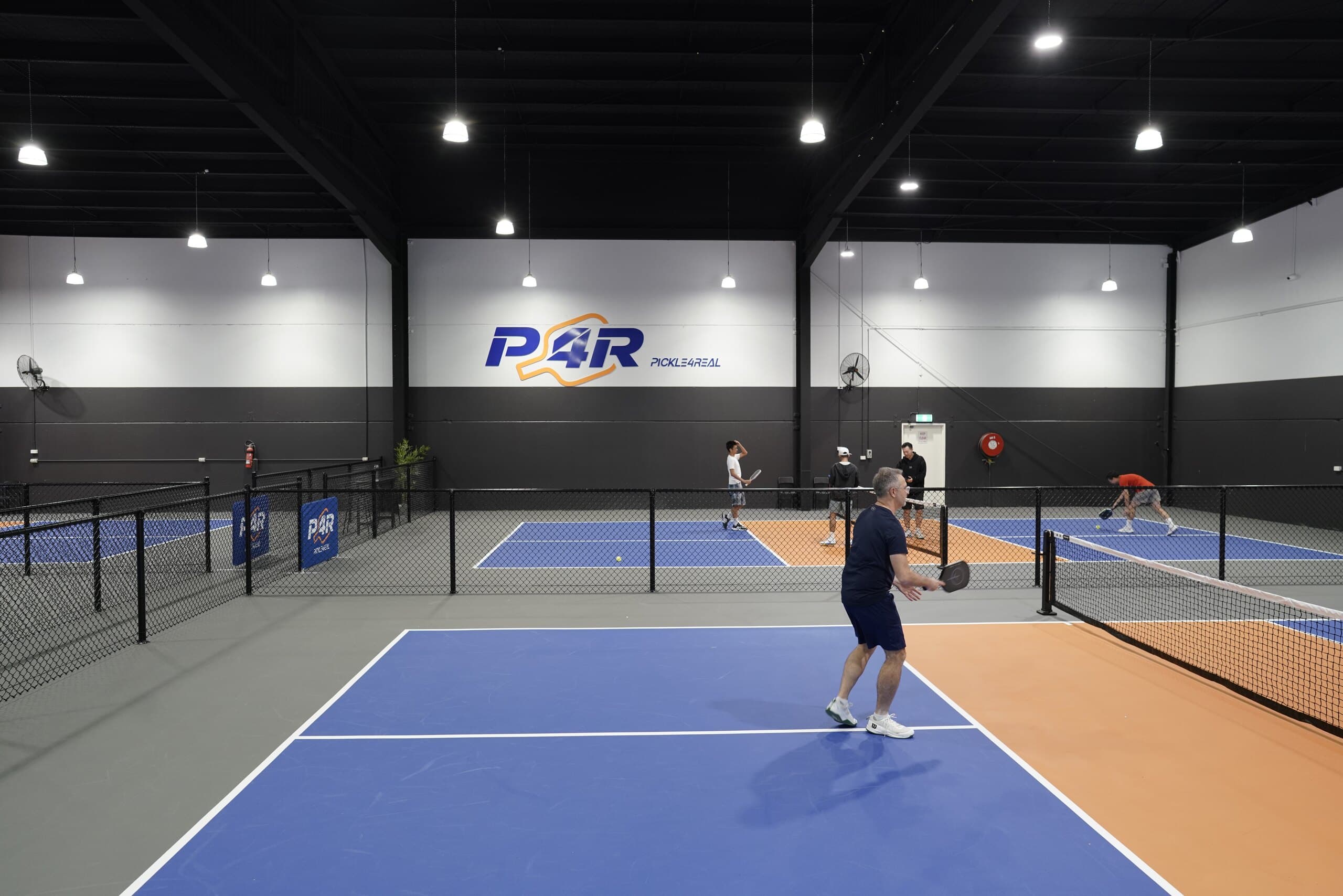 Players on the indoor pickleball courts at Pickle4Real Mentone